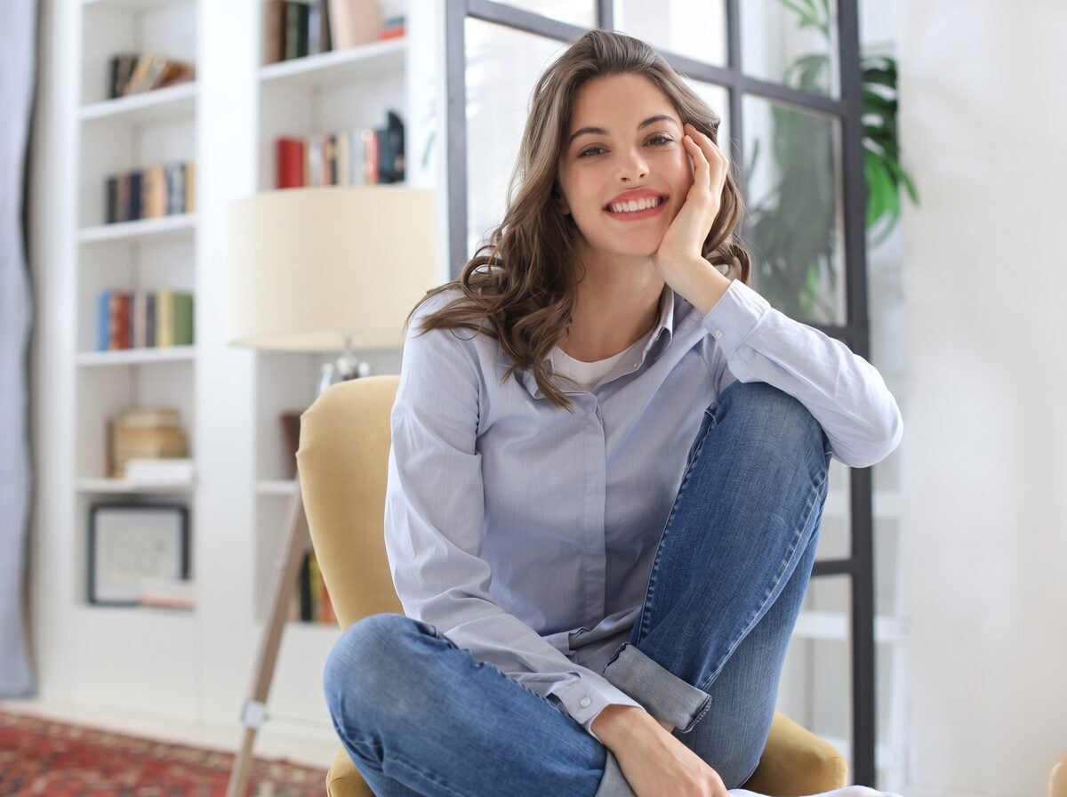 A woman sitting comfortably at home